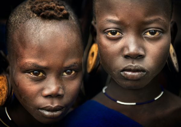 Fine Art Portrait of Young Warriors from Mursi Tribe by professional photographer Ignacio Palacios